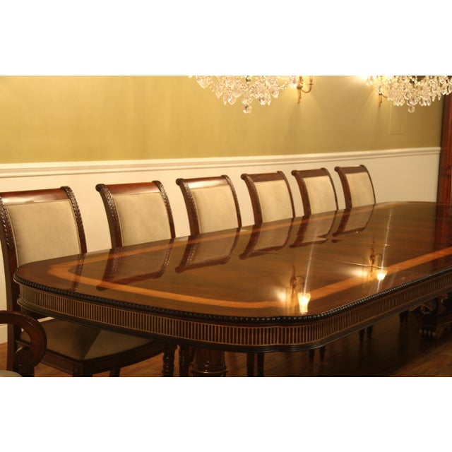 Neoclassical Dining Table with Gold Leaf American Empire or Regency-style dining table. Extra wide (54-inch) mahogany...