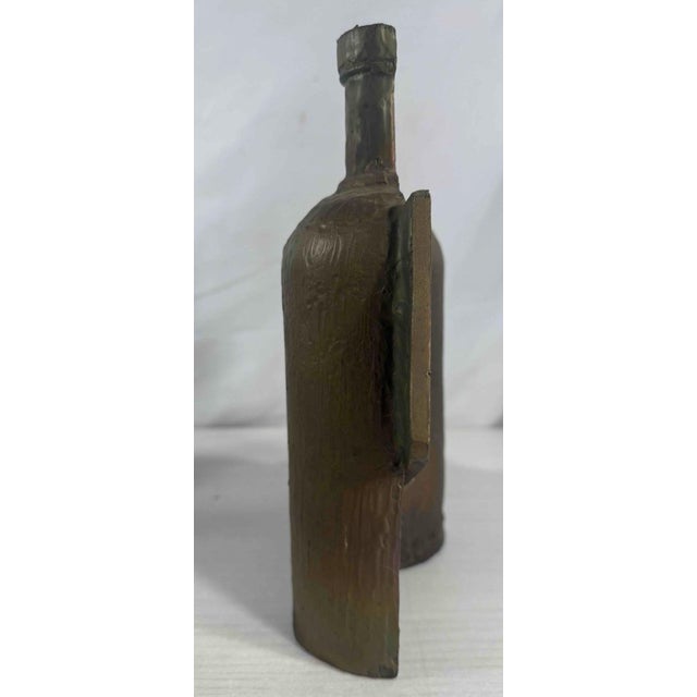 Abstract bronze sculpture titled "Absolut/Halved & Flattened" by local artist Herbert Simon. Created in 2001. Part of the...