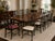 A striking mid-20th-century, circa 1940s–1960s set of ten dining chairs by the Grand Ledge Chair Company of Grand Ledge,...