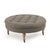 The Maison Tufted Round Ottoman from Zentique features a generous round button-tufted top on turned wood legs with brass...