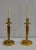 Set of two fully golden bronze candlesticks. Each of them consists of a carped central barrel, surmounted by a scallory...