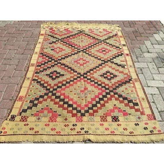 This beautiful, vintage, handwoven kilim is approximately 60 years old. It is handmade, of very fine quality in all...