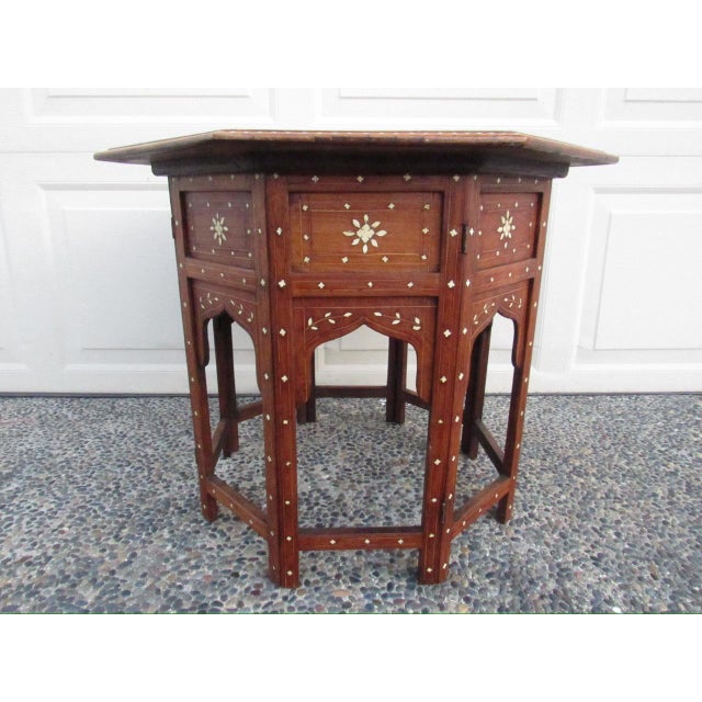 Antique Anglo Indian inlaid table, c.1900 A fine quality and condition teakwood table inlaid with a floral and geometric...
