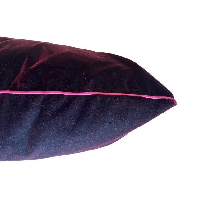 This pillow features a luxurious deep burgundy velvet with a smooth, rich texture that exudes elegance and sophistication....