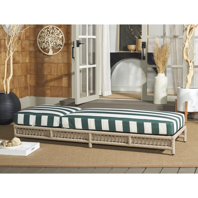 Introducing the Callan Lounger in heather tan and hunter green stripe. This outdoor lounge chair seamlessly combines style...