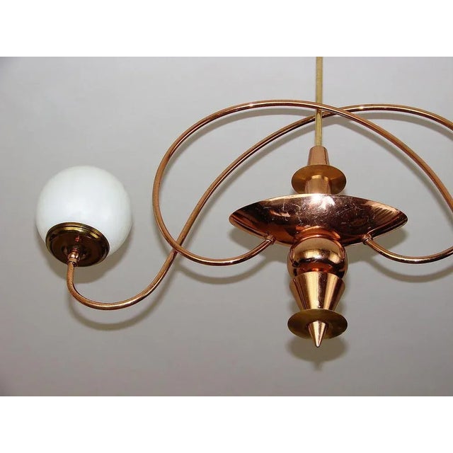 Mid-Century chandelier, 1960s. It was made of brass steel, brass and glass. The chandelier requires 2 bulbs E14....