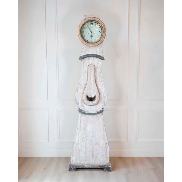 A charming 19th-century Scandinavian longcase clock in painted pine, distinguished by its slender, elongated silhouette...