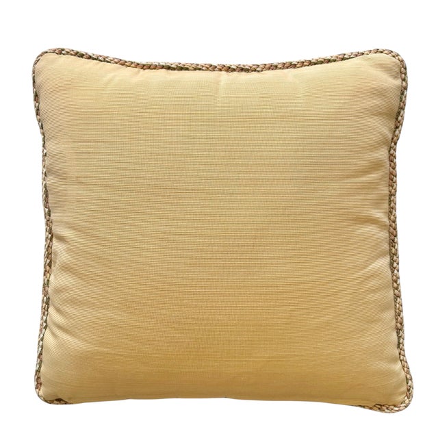 A vibrant vintage toss pillow having a face fabric in crewel botanical and a secondary fabric in a warm and textural gold...