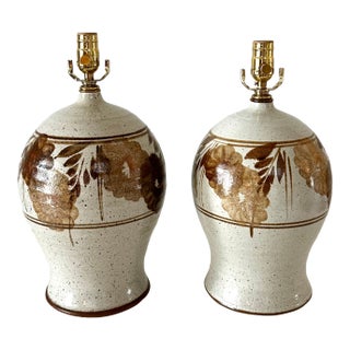 1970s Hand Thrown Stoneware Lamps With Floral Motif - a Pairf For Sale