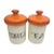 Mid-Century canister set of four in off white ceramic with bright 60's orange lids. Four canisters in all, all in good...