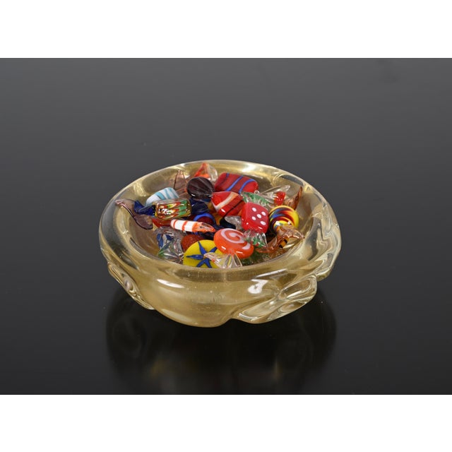 Fantastic hand blown mid-century Murano glass bowl with gold dots. This fantastic object is attributed to the designer...