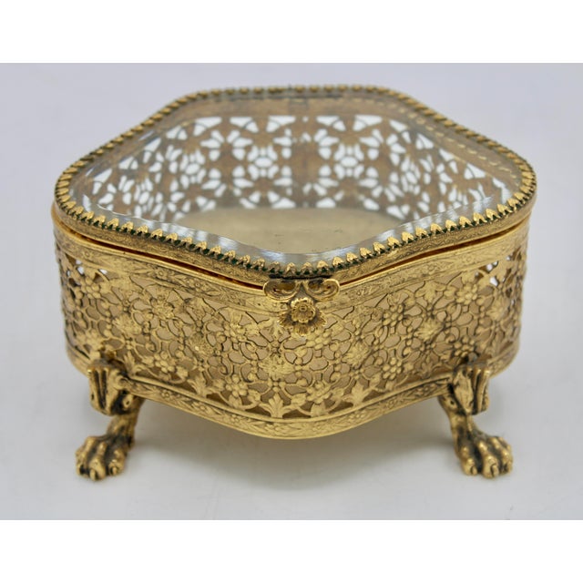 A lovely beveled glass French jewelry box, circa 1950s. This is a stunning vintage jewelry box that has unique lion’s feet.