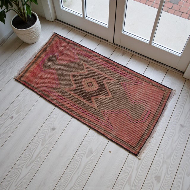 Knotted by the hands of Southeastern Anatolian villagers in the 1970s for their own personal use — not for trade — this...