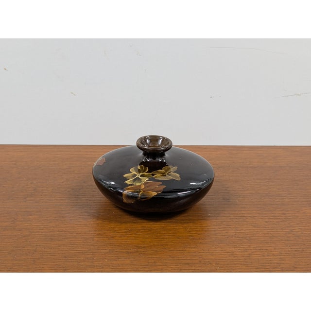 This rare antique Louwelsa Weller art pottery squat vase showcases the masterful hand-painted floral artistry that defines...