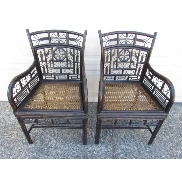 Pair of vintage ebonized bamboo armchairs in the Brighton Pavillion or Chinoiserie style, c.1950’s A good looking pair of...