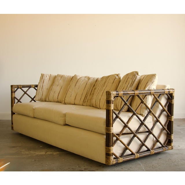 Hollywood Regency Vintage Rattan Trellis Lattice Sofa in the Style of McGuire With Casters, Wrapped Joints, and Ivory Upholstery, 1970s For Sale - Image 3 of 9