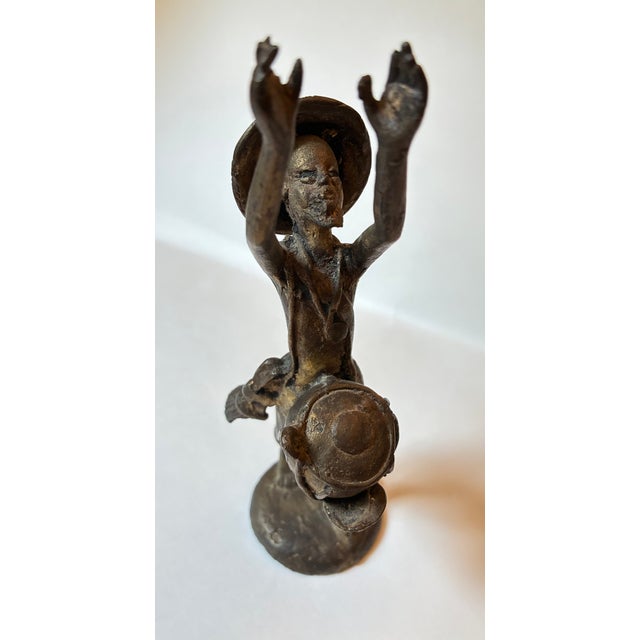 Stunning, authentic vintage West African tribal folk art figurine depicting a traditional musician playing a waist-mounted...