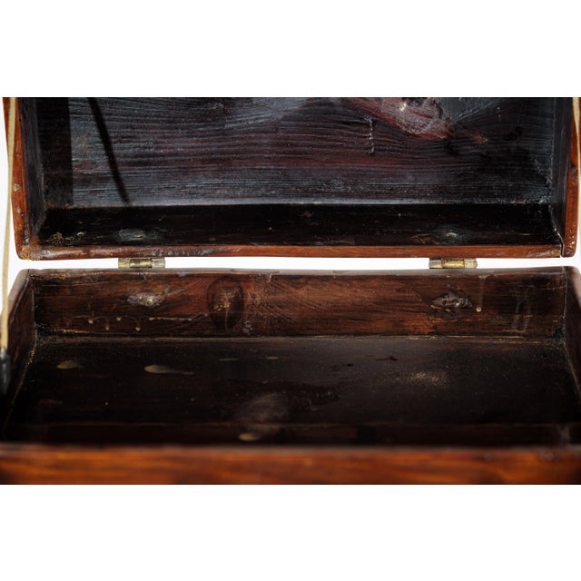 This antique Chinese dressing case features a warm brown lacquer finish over softwood, with a rich grain pattern and a...