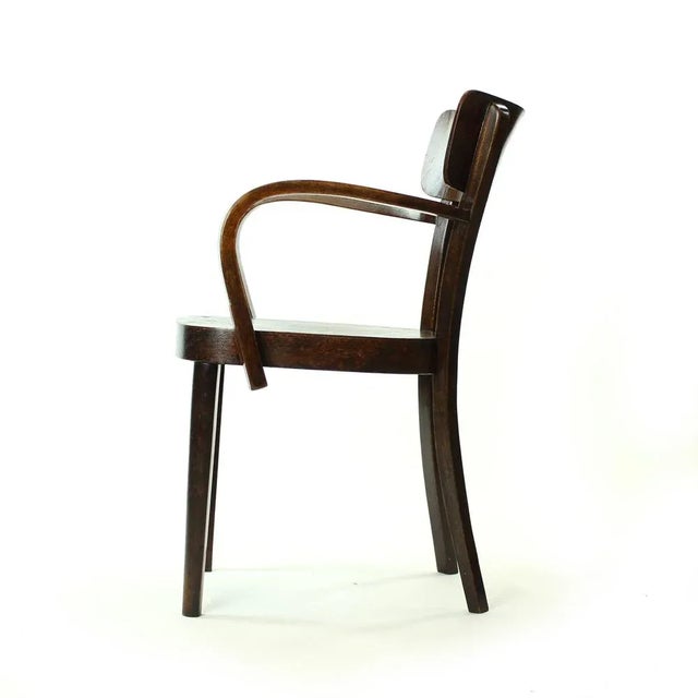 This beautiful office chair was produced according to Thonet designs from 1920s. The chair was however produced by Tatra...