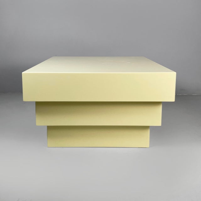 Italian modern coffe table or pedestal in light yellow wood, 1980s Pedestal or coffee table with a square top, made...