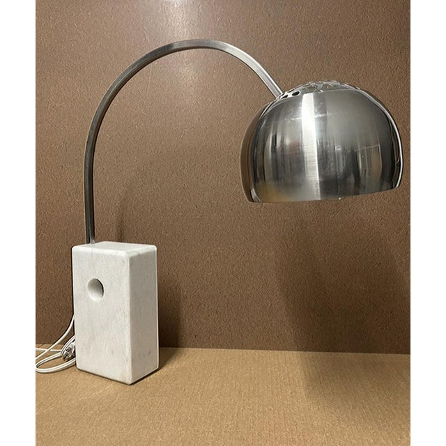This is an Arco Table Top Lamp made in the style designed by Pierre-Giacomo & Achille Castiglioni. This lamps versatility,...