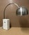 This is an Arco Table Top Lamp made in the style designed by Pierre-Giacomo & Achille Castiglioni. This lamps versatility,...