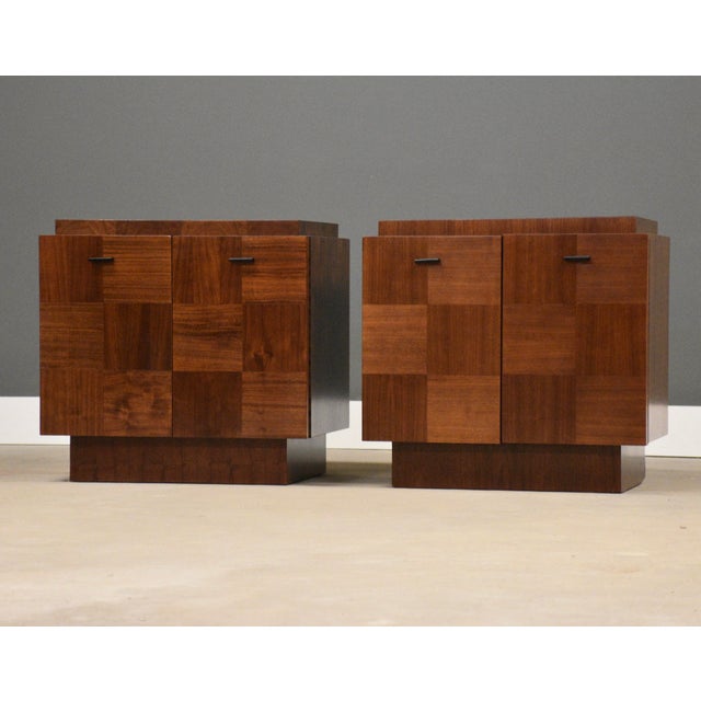 A pair of mid century modern brutalist style walnut two door nightstands. Professionally refinished. Made in Canada. Circa...