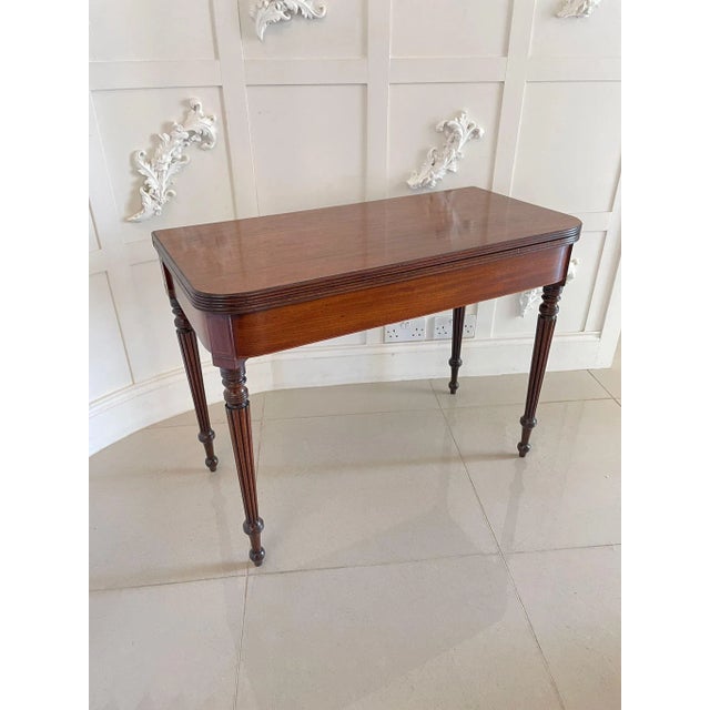 Antique regency quality mahogany card table having a quality mahogany top with a reeded edge opening to reveal the...