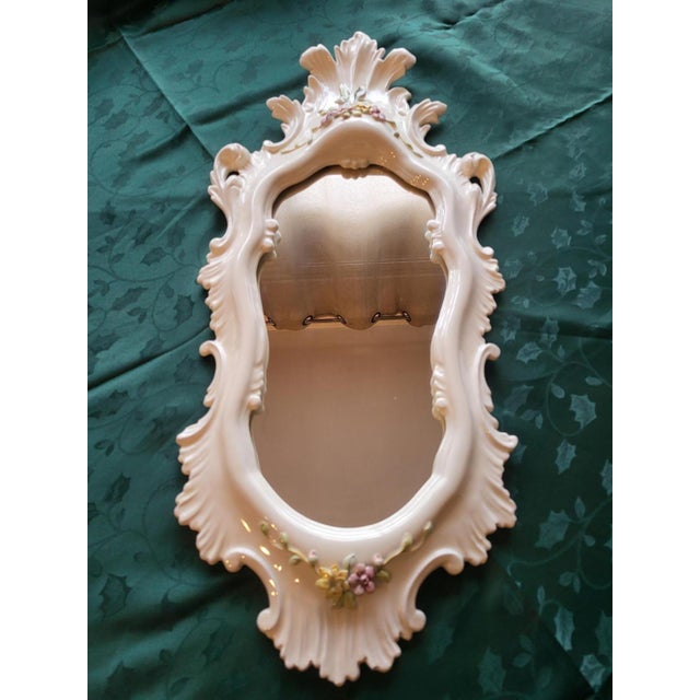 Large mirror, La Farnesiana of Parma, designed by Carlo Corvi, made of white majolica ceramic, decorated with delicate...