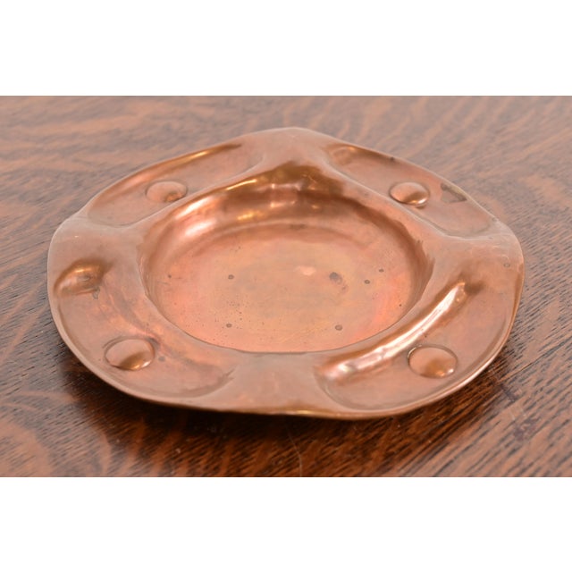 A gorgeous antique Arts & Crafts period hand hammered copper ashtray or catchall By Gustav Stickley (signed to the...
