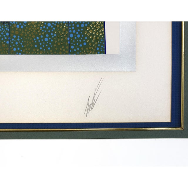 Serigraph in colors with foil stamping and embossment on wove paper. Hand signed lower right by Erte. Hand numbered...