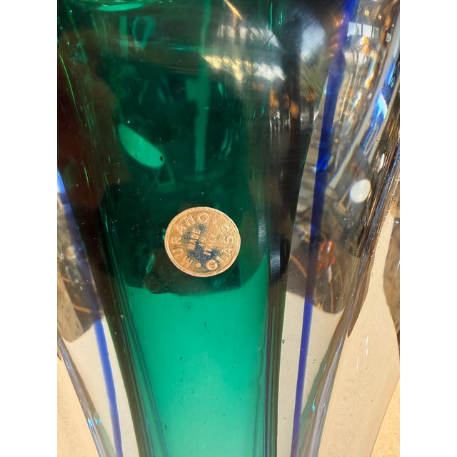 Sculptural Murano glass vase crafted in the sommerso technique, featuring layered tones of deep blue and teal encased in...