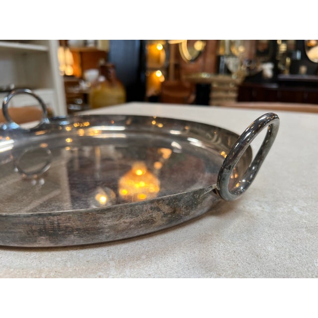 The Mid Century Italian Silver Plated Round Bowl from the 1970s exudes timeless elegance with its sleek design and...