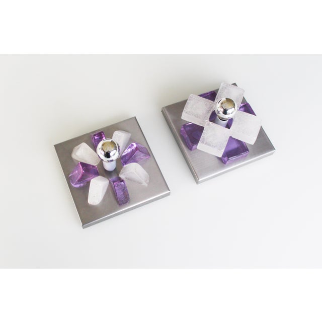 Brutalist wall sconces by Poliarte, Italy 1970’s. Brushed aluminum frame holding heavy pieces of glass. Design by Albano...