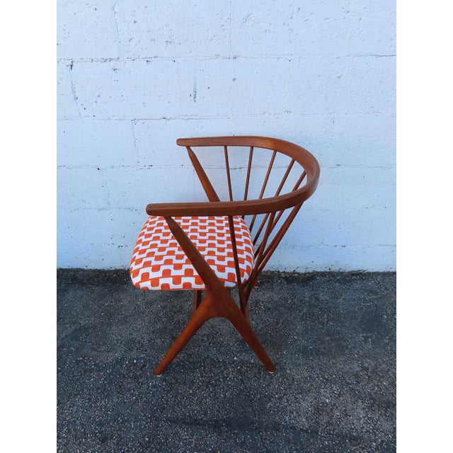 This high quality Chair is made out of wood, solid wood, teak wood, and upholstery. It proudly bears a stamp, "Sibast...