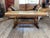 Italian Wilhelminian-Style Coffee Table Features a Polished Honey-Toned Onyx or Marble Slab Top Resting on an Ornately Carved Double-Pedestal Wooden Base For Sale - Image 3 of 12