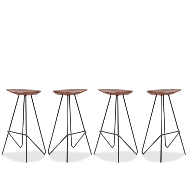 The Anthropologie Perch Stools, offered as a set of four, blend rustic warmth with modern minimalism. Featuring sculpted...