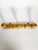 An elegant wall-mounted coat rack made of turned solid wood, featuring three generously sized spherical pegs. Its refined...
