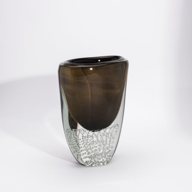 The Hand-Blown Modern Murano Vase in Black / Clear with 24-karat Gold Flecks and Bubbles is a masterful expression of...
