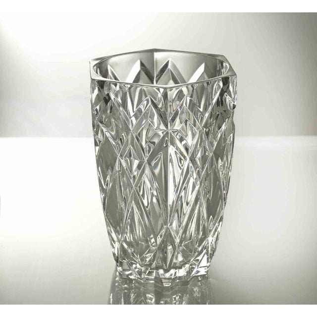 Vintage Glass Vase is a decorative object realized by Italian manufacturing in 1970s. A very elegant transparent glass vse.