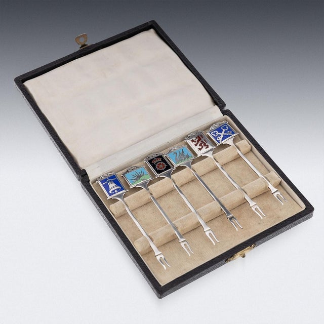 Mid 20th century english solid silver set of six cocktail picks, decorated with enamels depicting different pub signs....