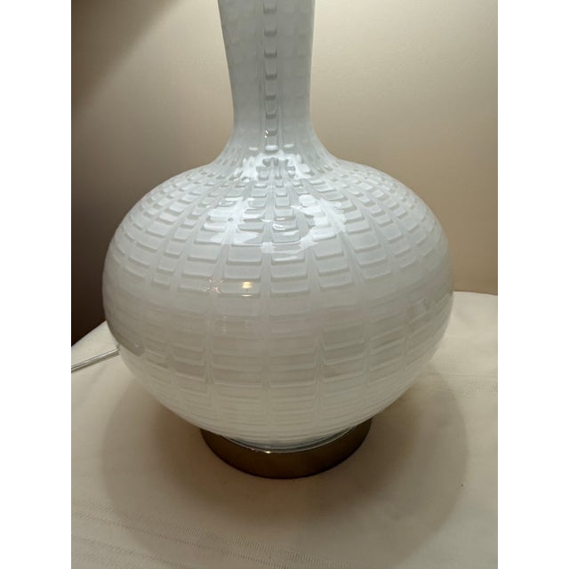 Bring clean lines and subtle texture to your decor with this striking, large-scale mid-century modern style table lamp....