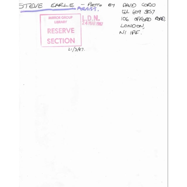 Black and white photograph of American singer Steve Earle taken March 21, 1987 by the British music photographer David...