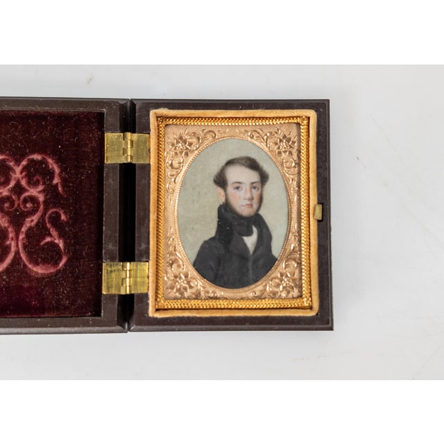 We are selling this fabulous American miniature portrait painting. This painting of a young gentleman is very well done....