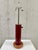 Original vintage Walter Von Nessen table lamp in red enameled cylinder with marble base. Double socket and turn switch on...