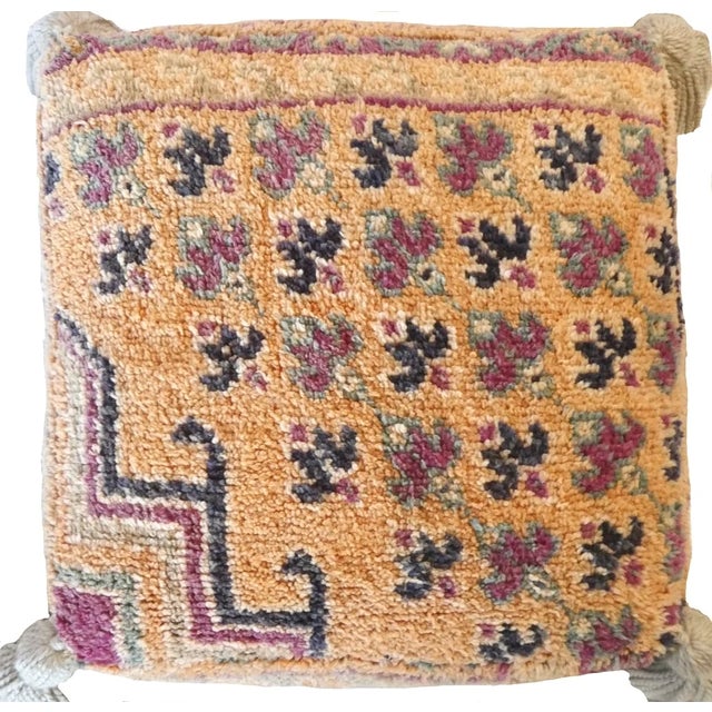 Moroccan floor pouf made from an abstract midcentury rug handwoven in apricot, sage green and indigo hand spun wool....