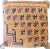 Moroccan floor pouf made from an abstract midcentury rug handwoven in apricot, sage green and indigo hand spun wool....