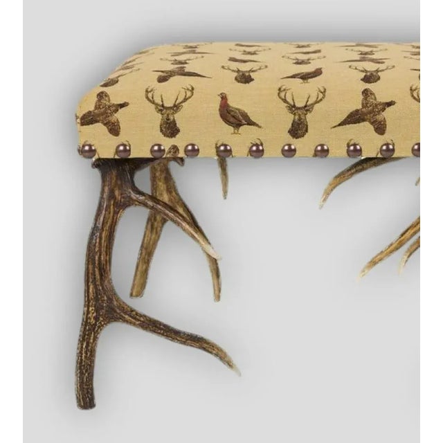 A stunning stool handmade in Scotland from Scottish Red and Fallow deer Antlers, covered in Hines Highland Beige Tapestry....