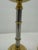 Pair of modernist chrome and brass candlesticks. Both have been professionally polished and lacquered to maintain their...
