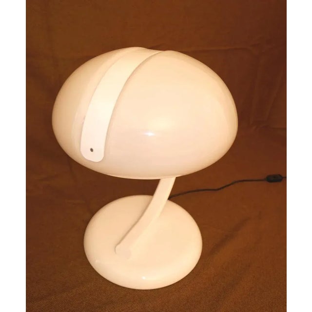 Table lamp with opal acrylic glass diffuser and white lacquered metal arm. "Director 2005" model by Valentino Benati for...